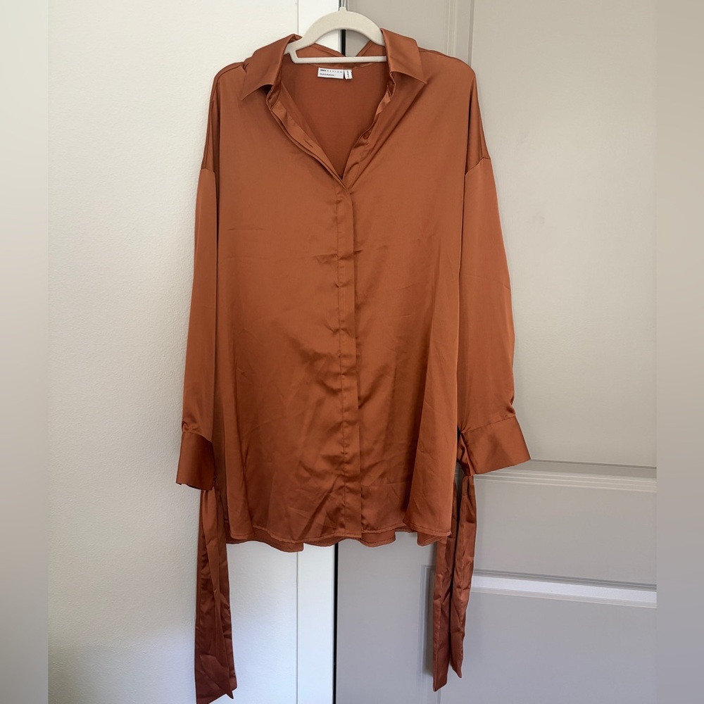 Rust orange button down blouse with tie sleeves